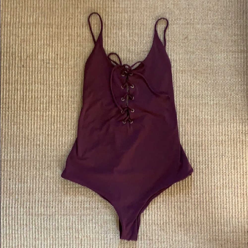 Tavik Monahan lace up one piece.
